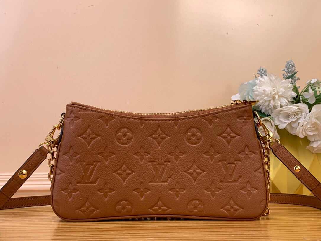 Louis Vuitton Liv Pochette empreinte leather