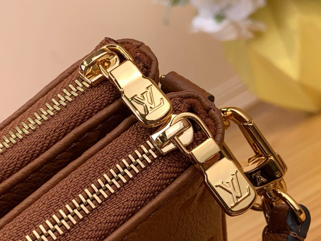 Louis Vuitton Liv Pochette empreinte leather