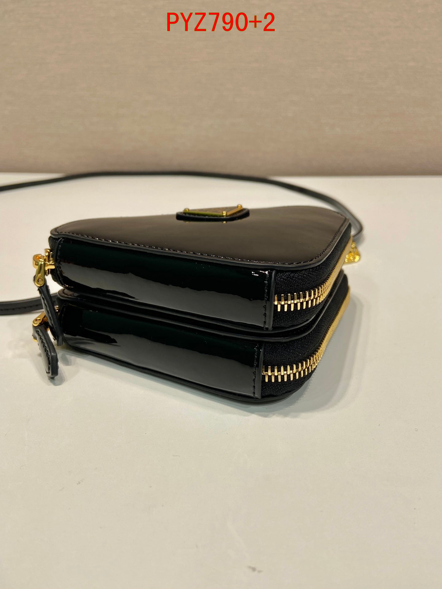 Prada Triangular patent leather mini pouch