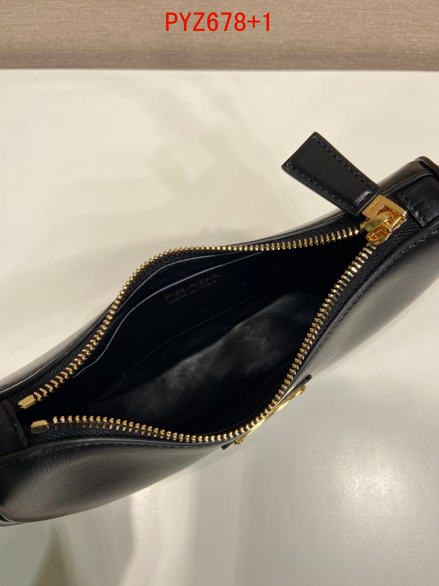 Prada Arqué leather mini shoulder bag