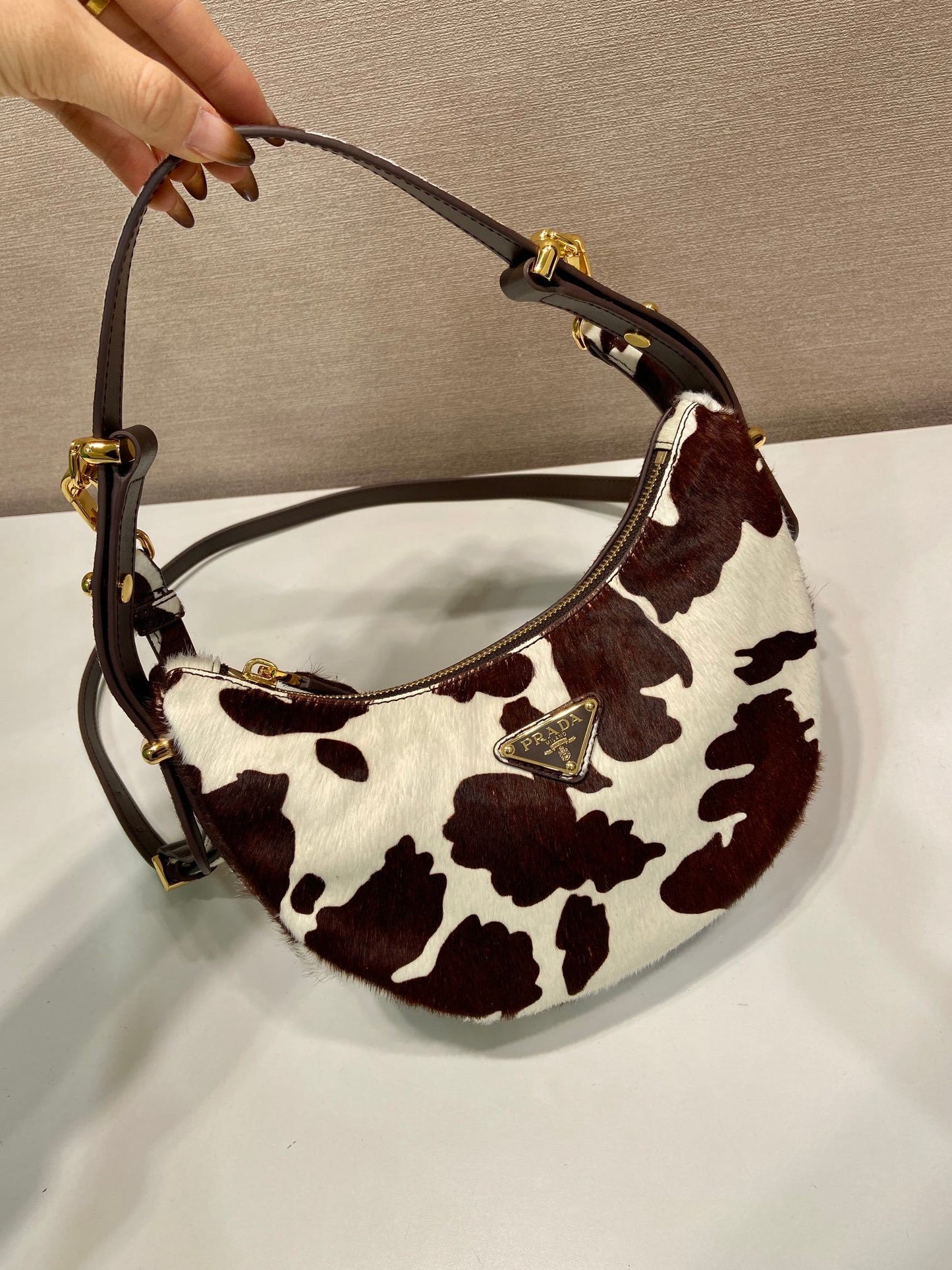 Prada Arqué printed leather mini hobo shoulder bag