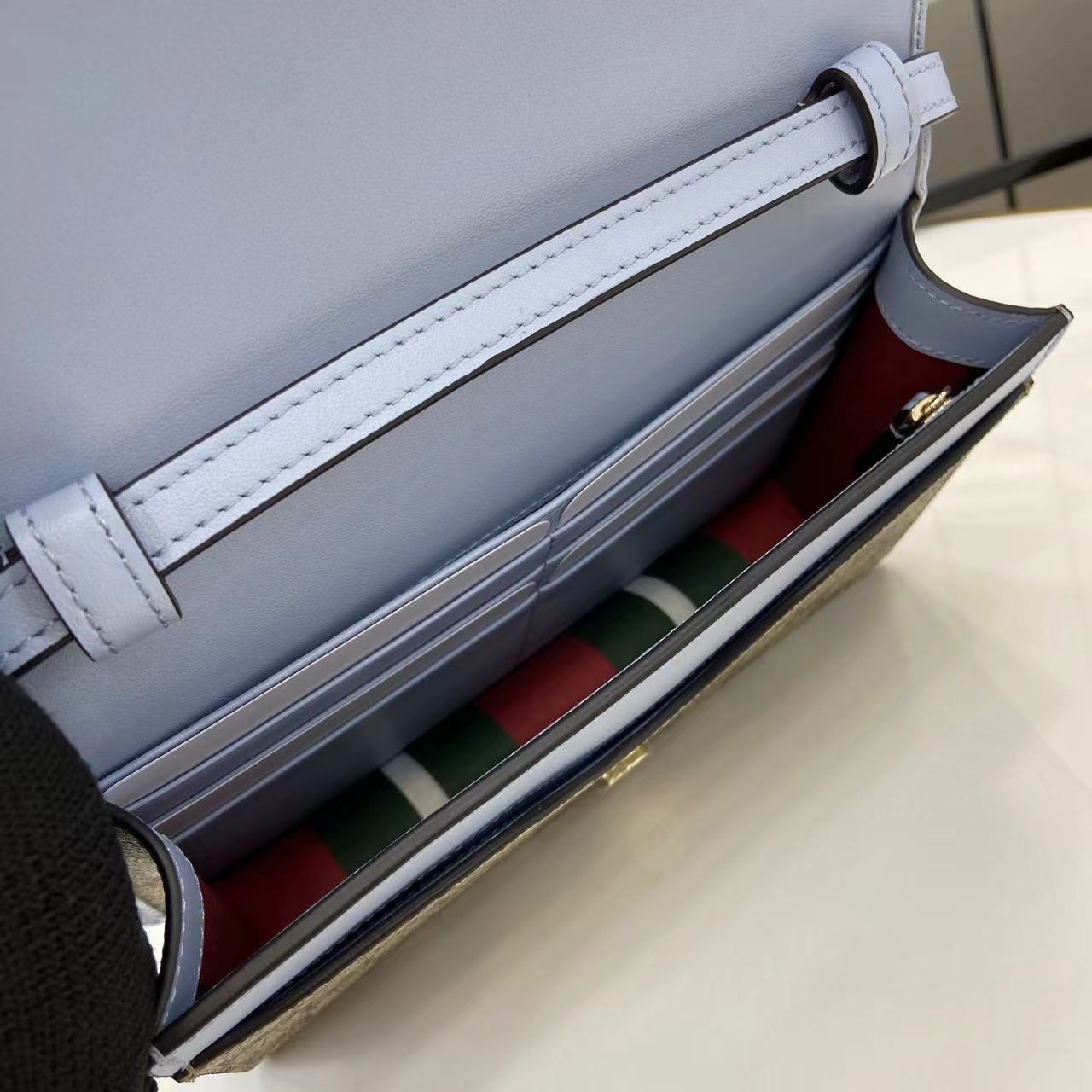 Gucci GG Emblem wallet with leather strap