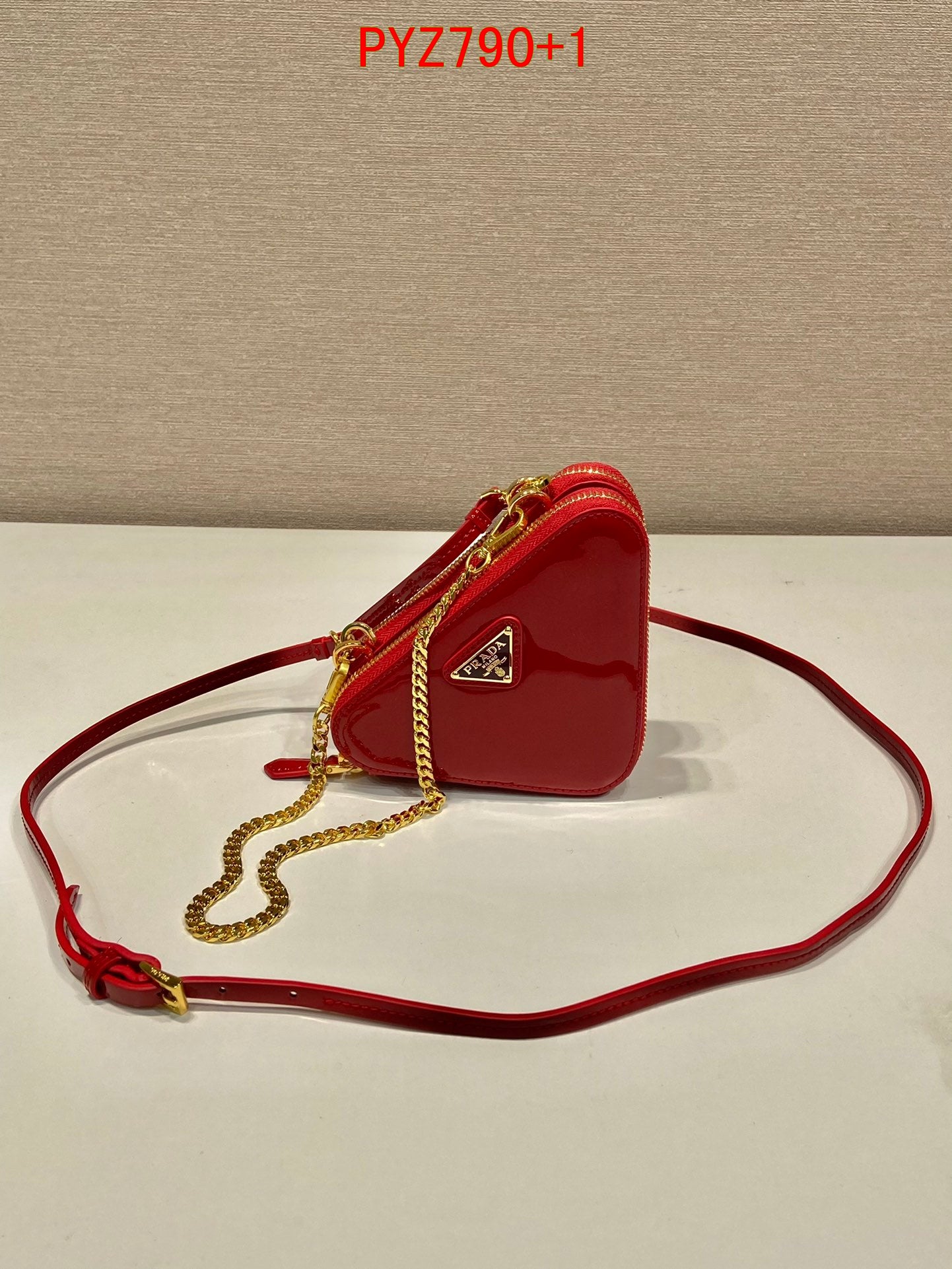 Prada Triangular patent leather mini pouch
