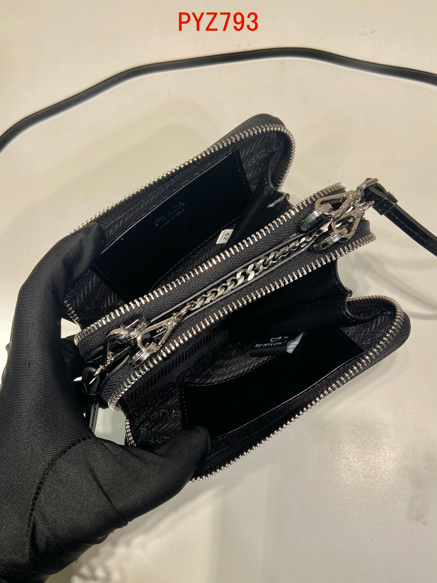 Prada Triangular embellished satin and leather mini-pouch
