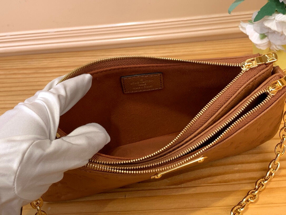 Louis Vuitton Liv Pochette empreinte leather