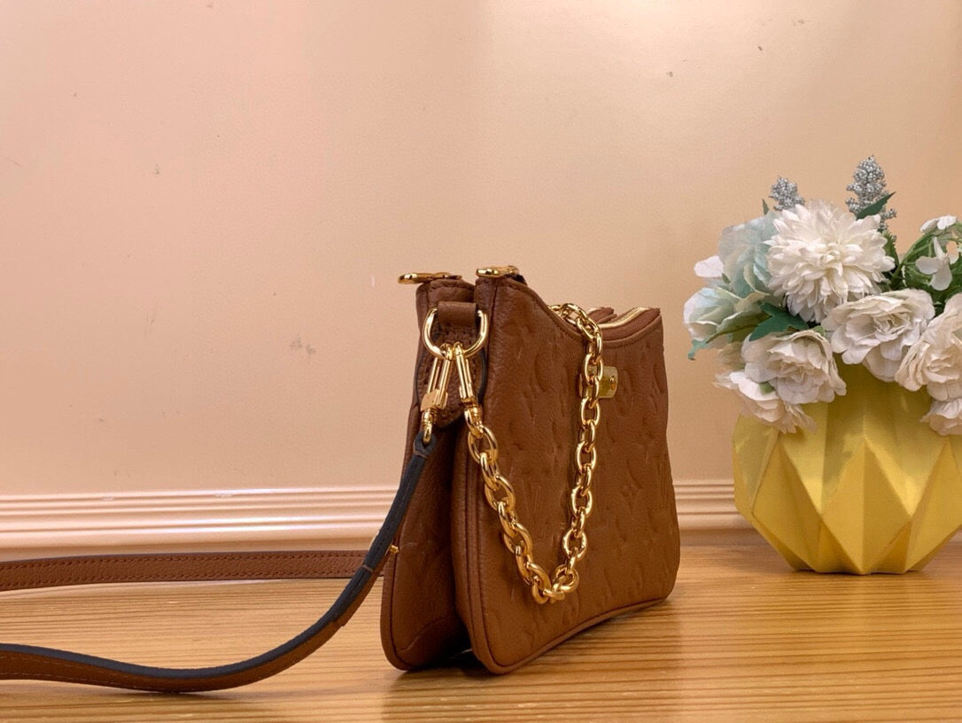 Louis Vuitton Liv Pochette empreinte leather