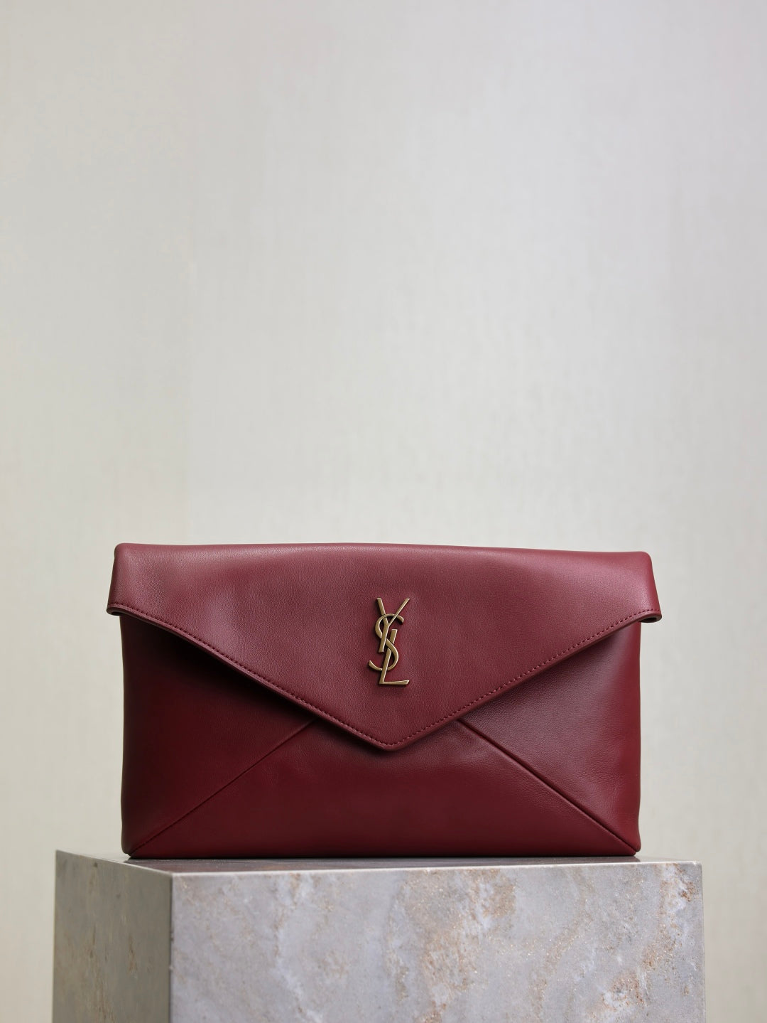 YSL CASSANDRE large envelope pouch in shiny leather