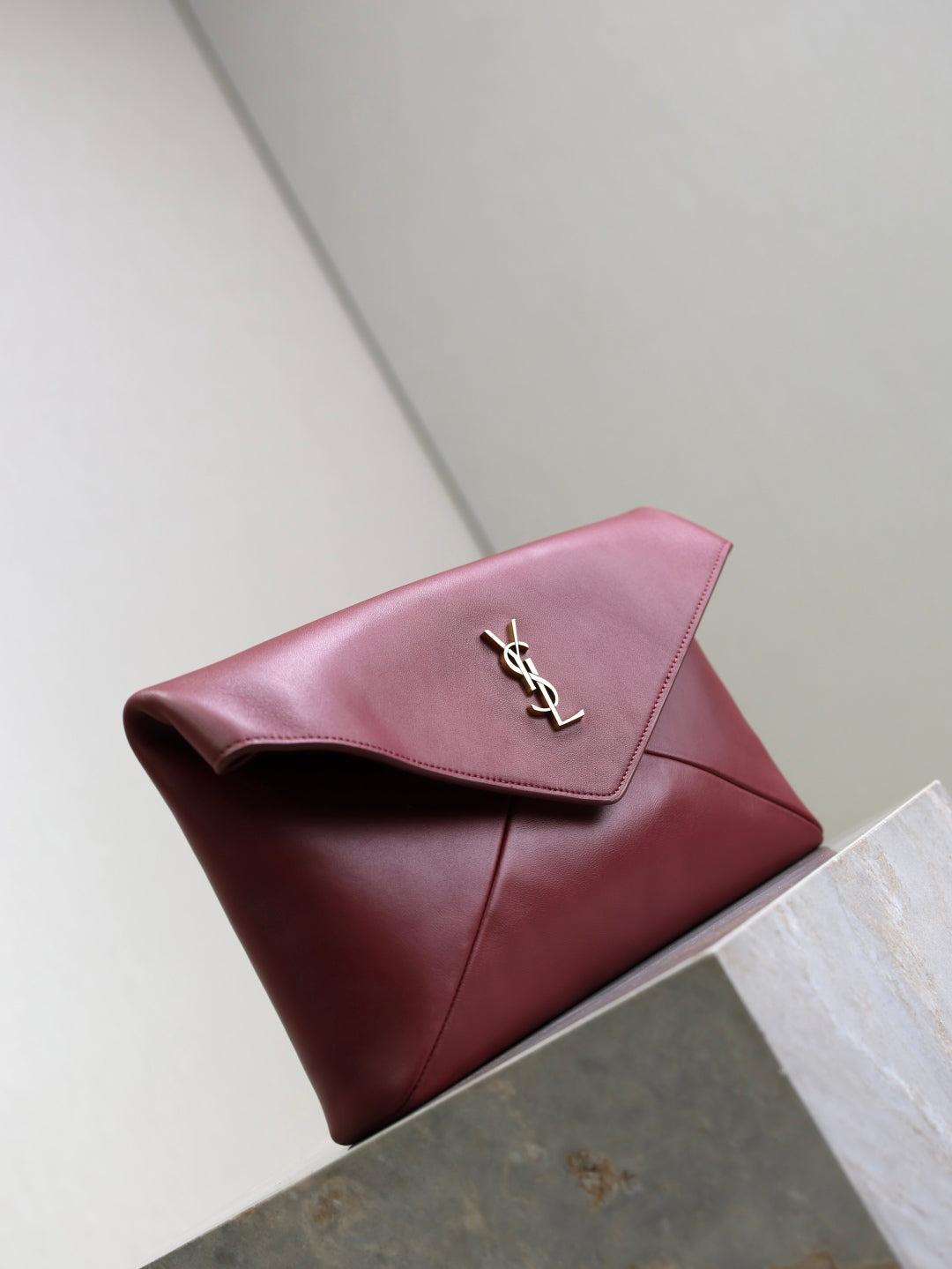 YSL CASSANDRE large envelope pouch in shiny leather