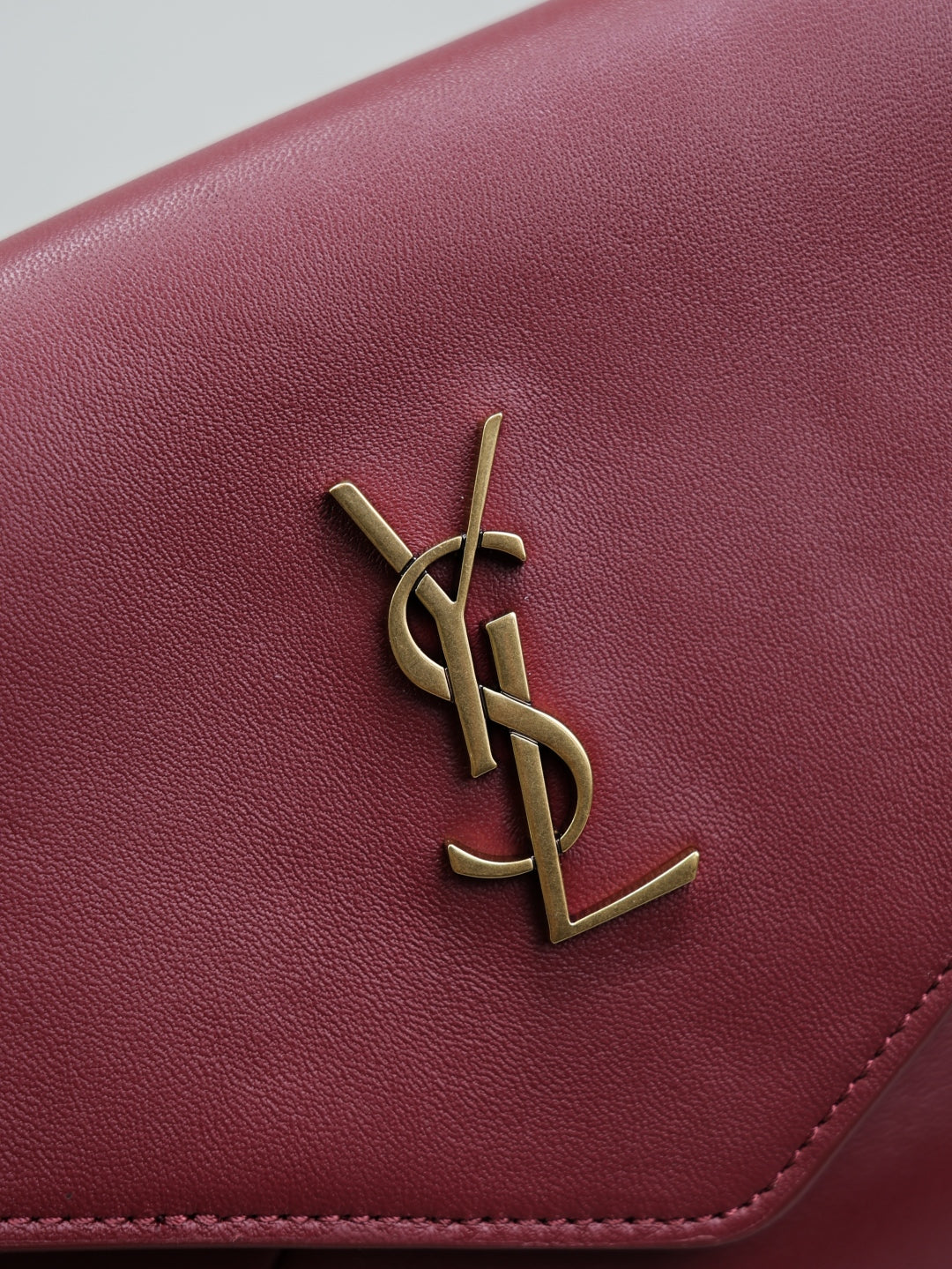 YSL CASSANDRE large envelope pouch in shiny leather