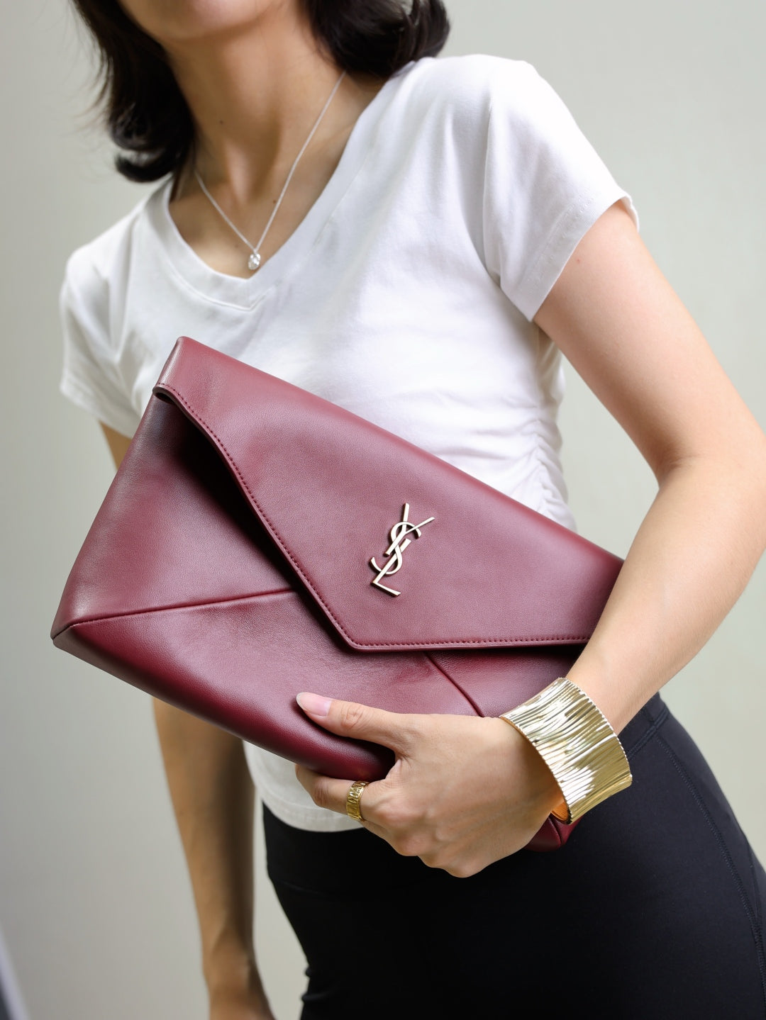 YSL CASSANDRE large envelope pouch in shiny leather