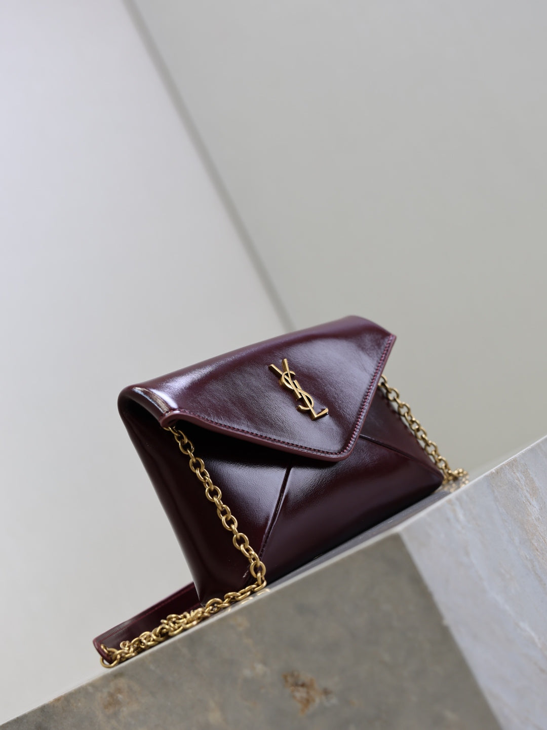 YSL CASSANDRE chain pouch in shiny leather