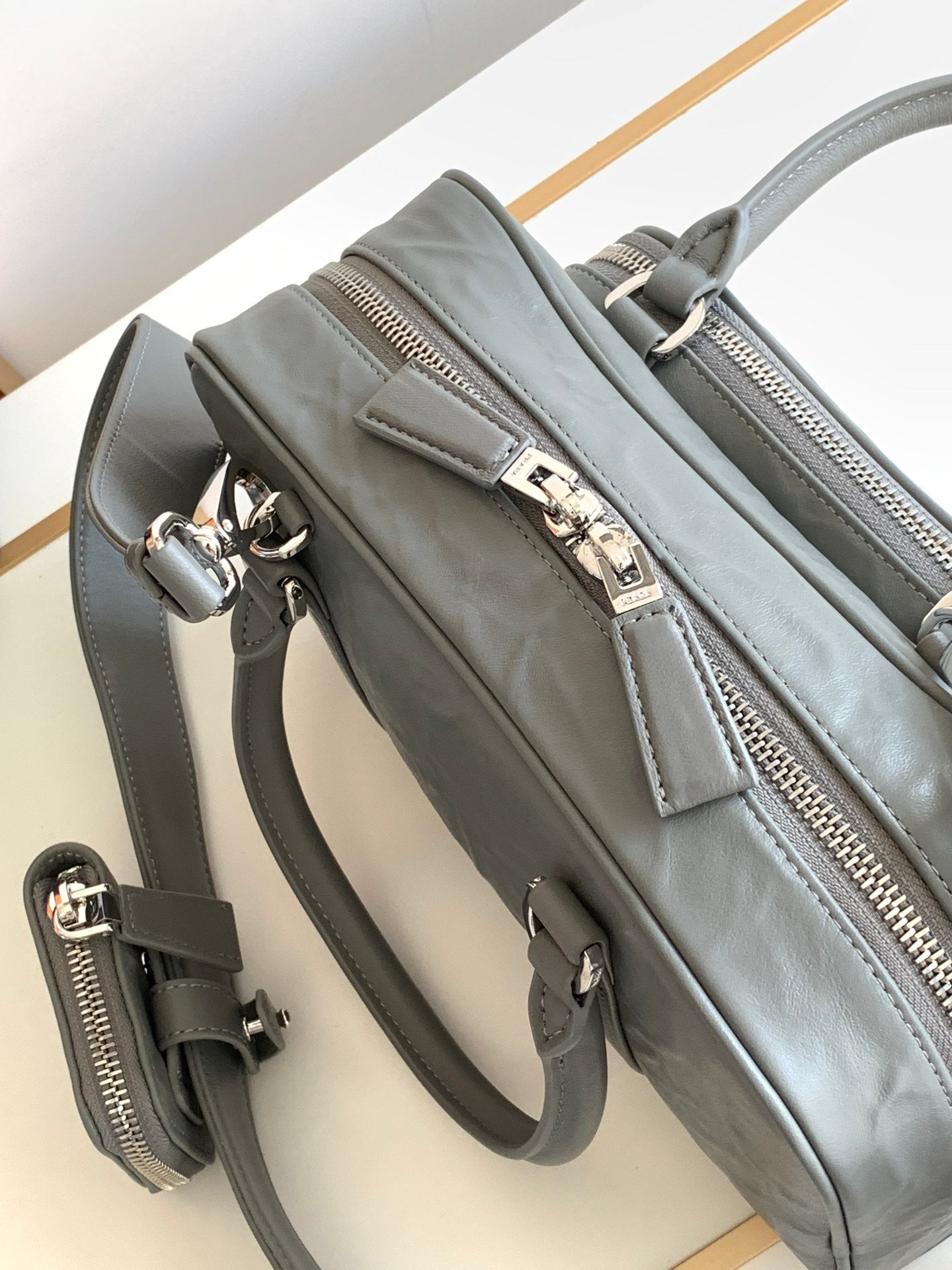 Prada Antique nappa leather multi-pocket top-handle bag