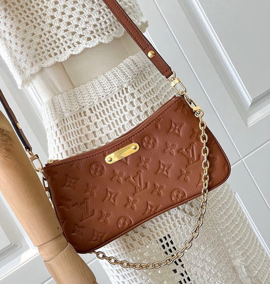 Louis Vuitton Liv Pochette empreinte leather