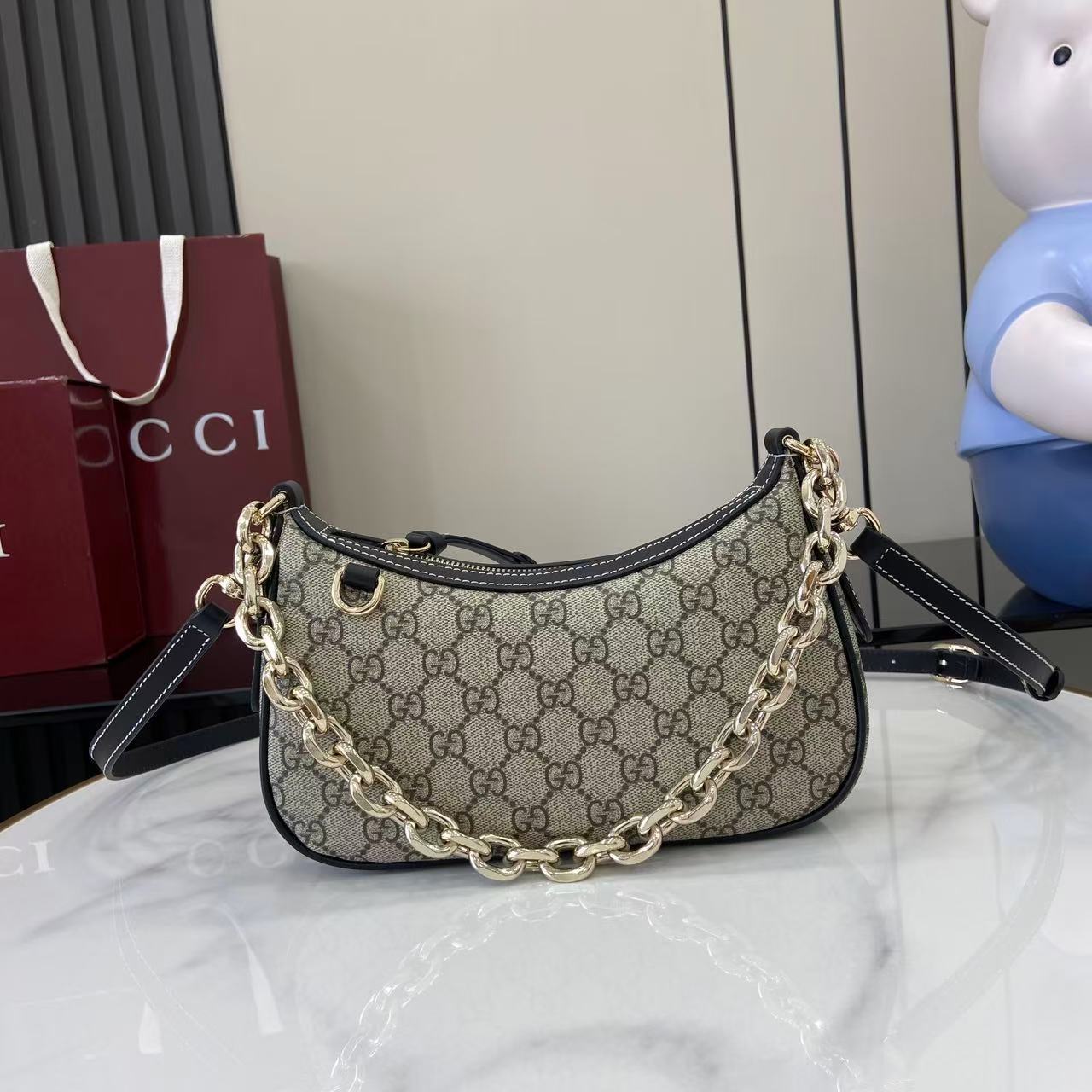 Gucci Emblem small shoulder bag with chain