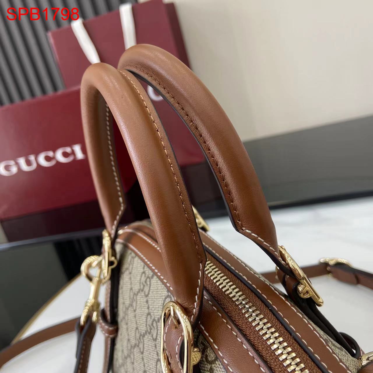 Gucci GG Emblem small top handle bag