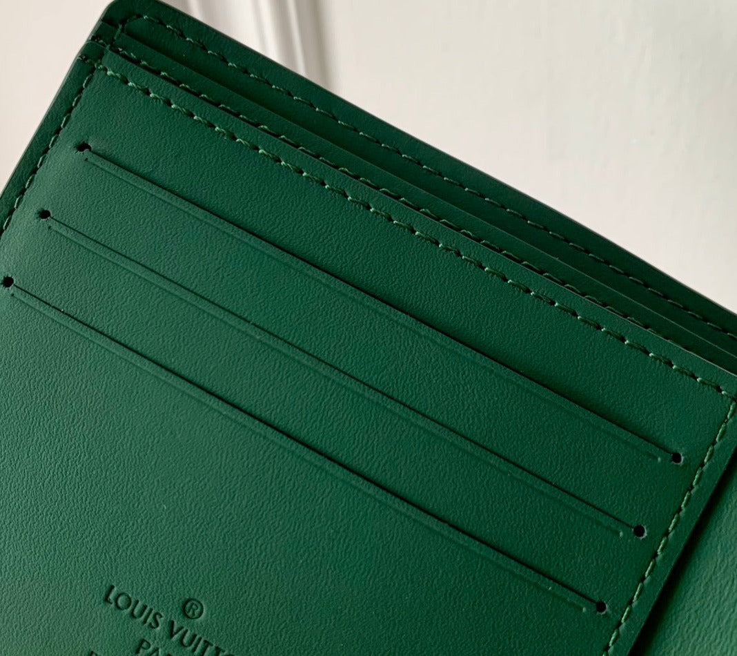 Louis Vuitton Multiple Wallet Taurllon leather