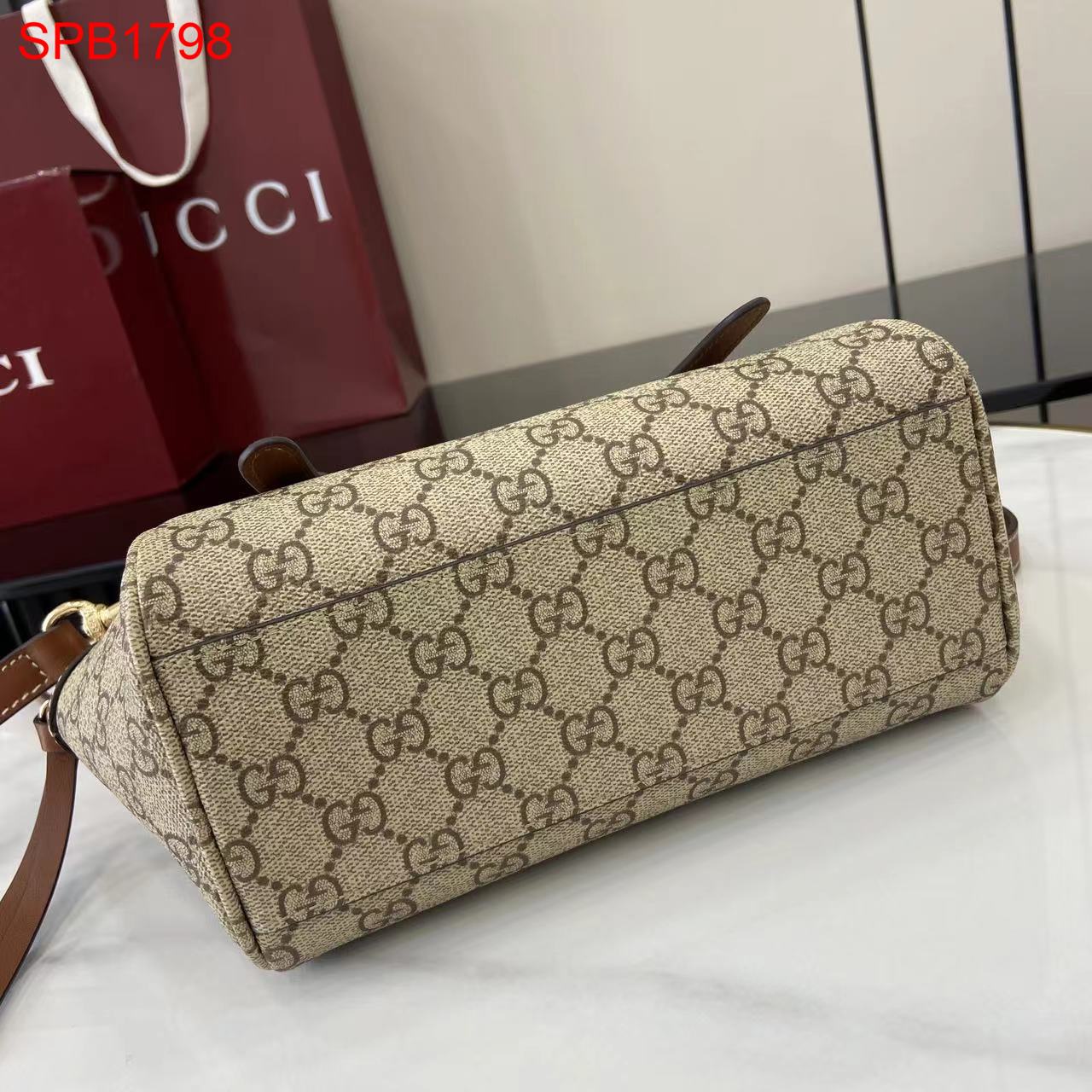 Gucci GG Emblem small top handle bag