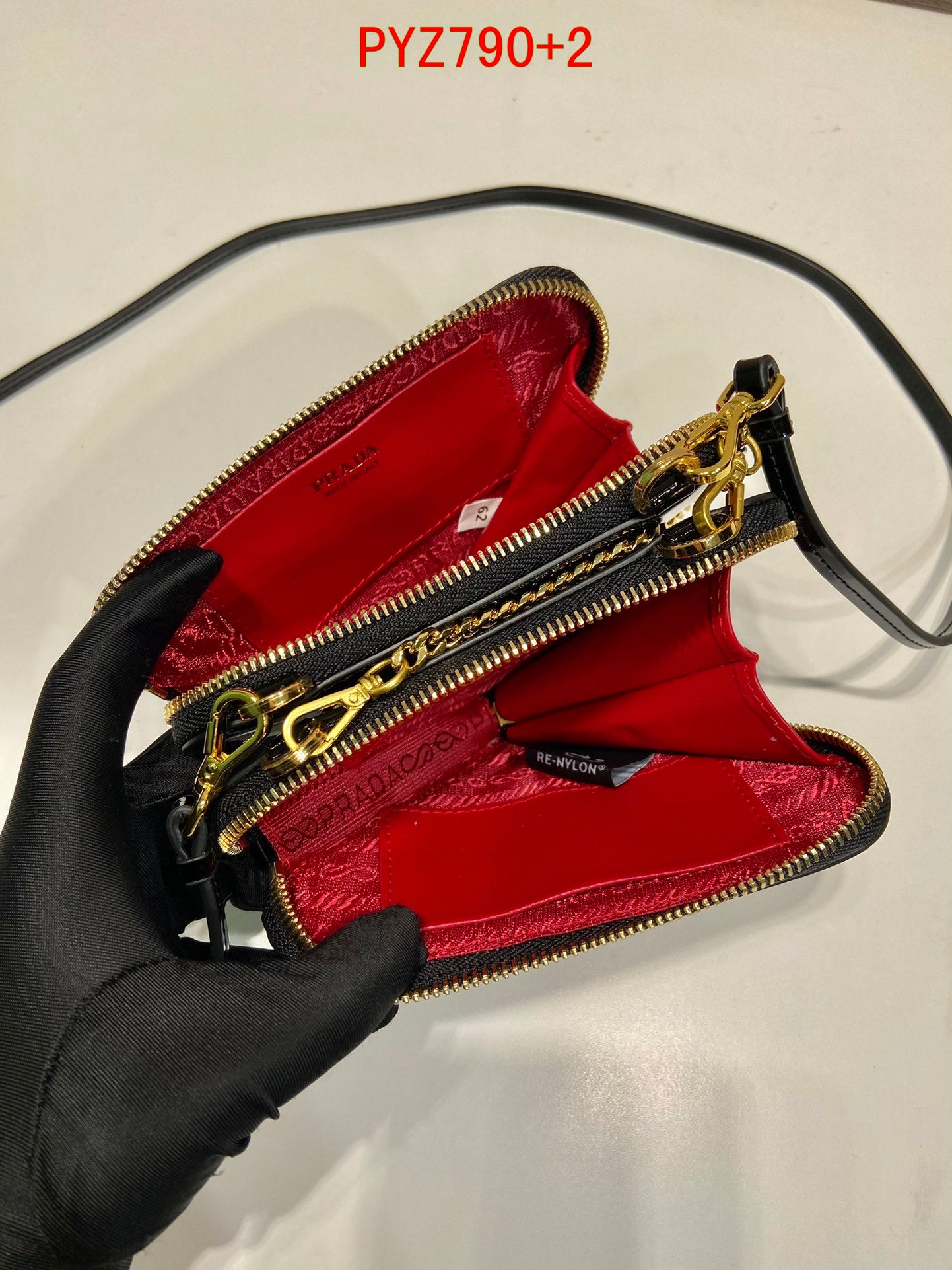 Prada Triangular patent leather mini pouch