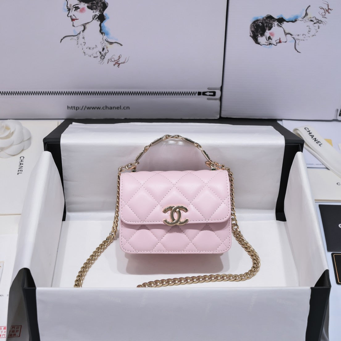 Chanel WOC mini with top handle