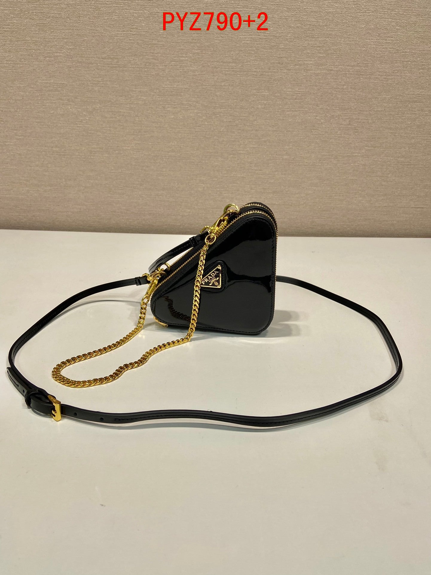 Prada Triangular patent leather mini pouch