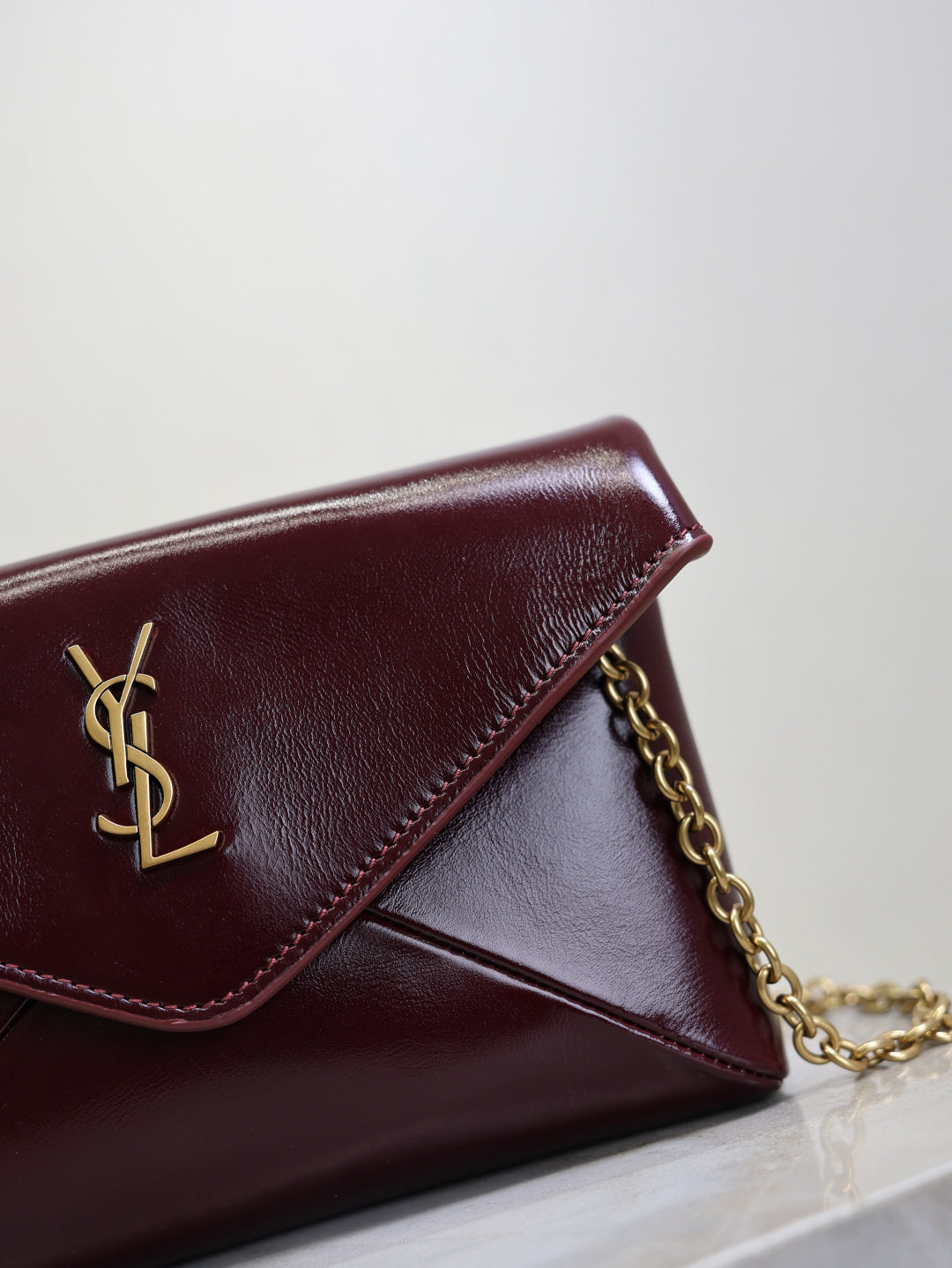 YSL CASSANDRE chain pouch in shiny leather