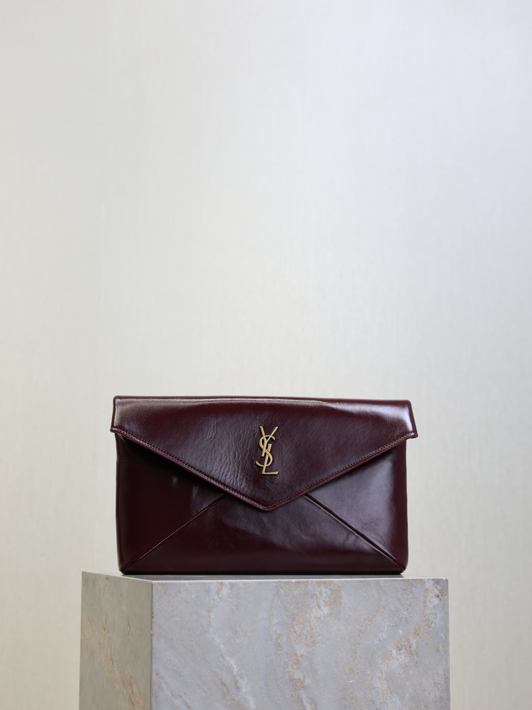 YSL CASSANDRE large envelope pouch in shiny leather
