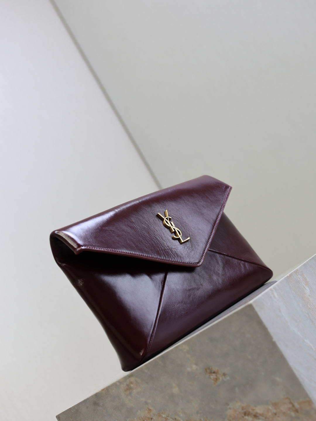 YSL CASSANDRE large envelope pouch in shiny leather
