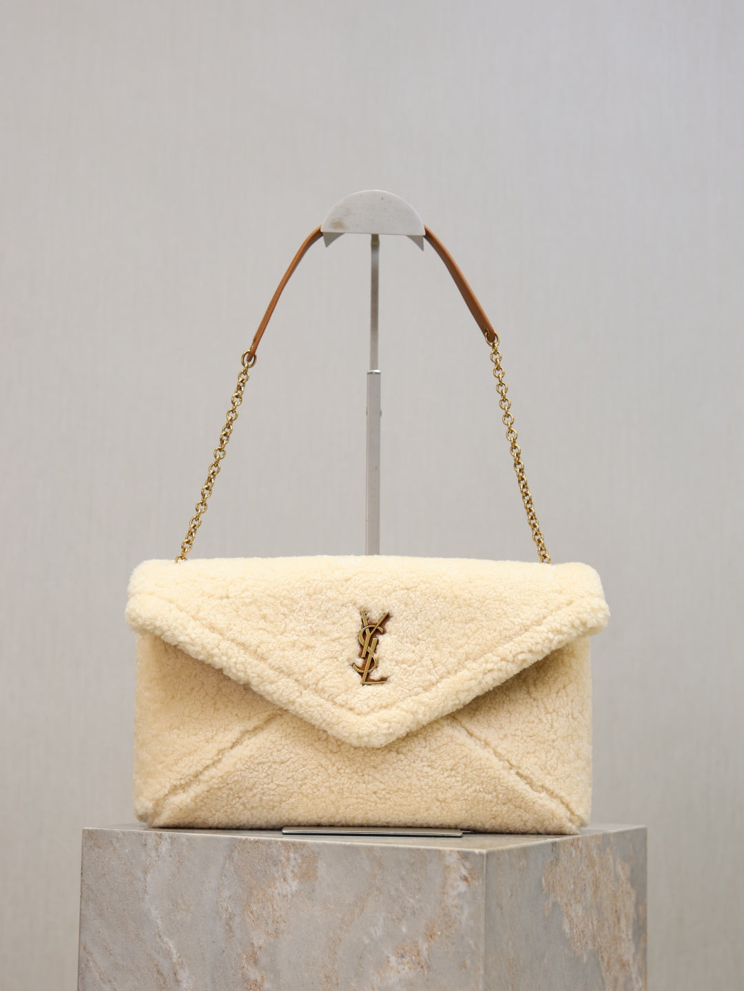 YSL CASSANDRE large pouch on chain in shearling