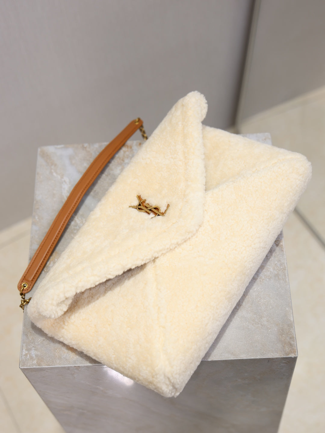 YSL CASSANDRE large pouch on chain in shearling