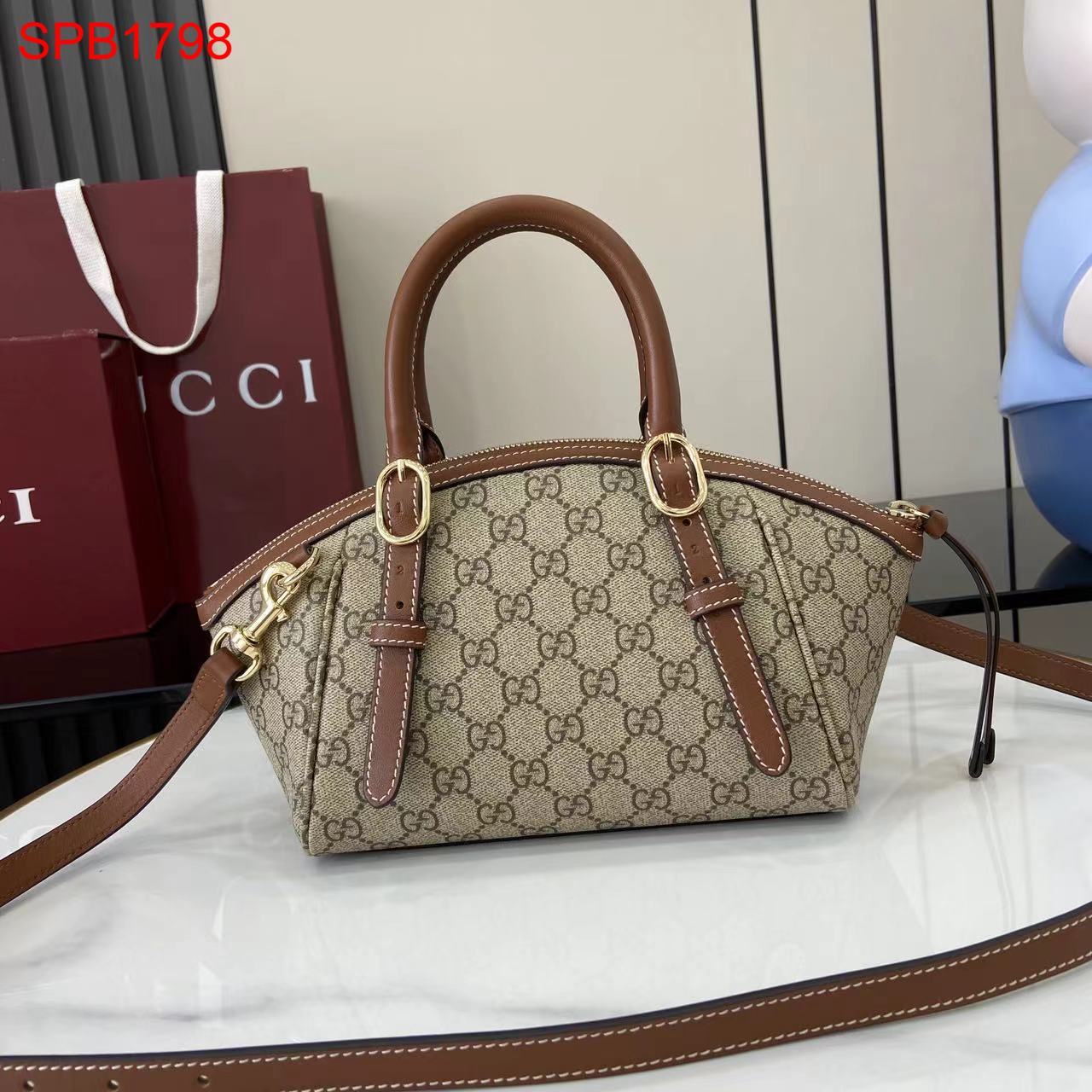 Gucci GG Emblem small top handle bag