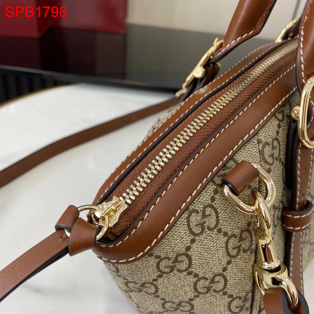 Gucci GG Emblem small top handle bag