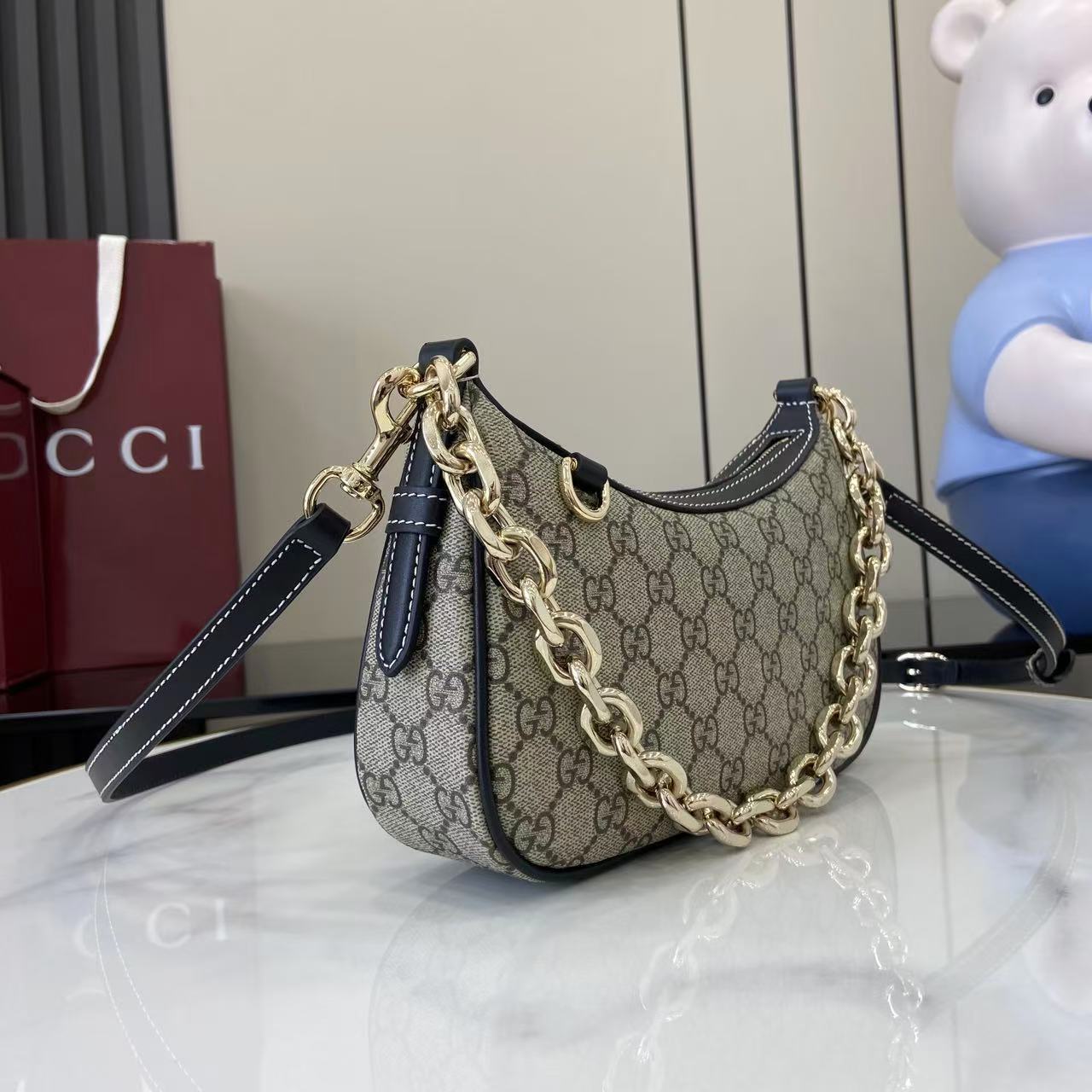 Gucci Emblem small shoulder bag with chain