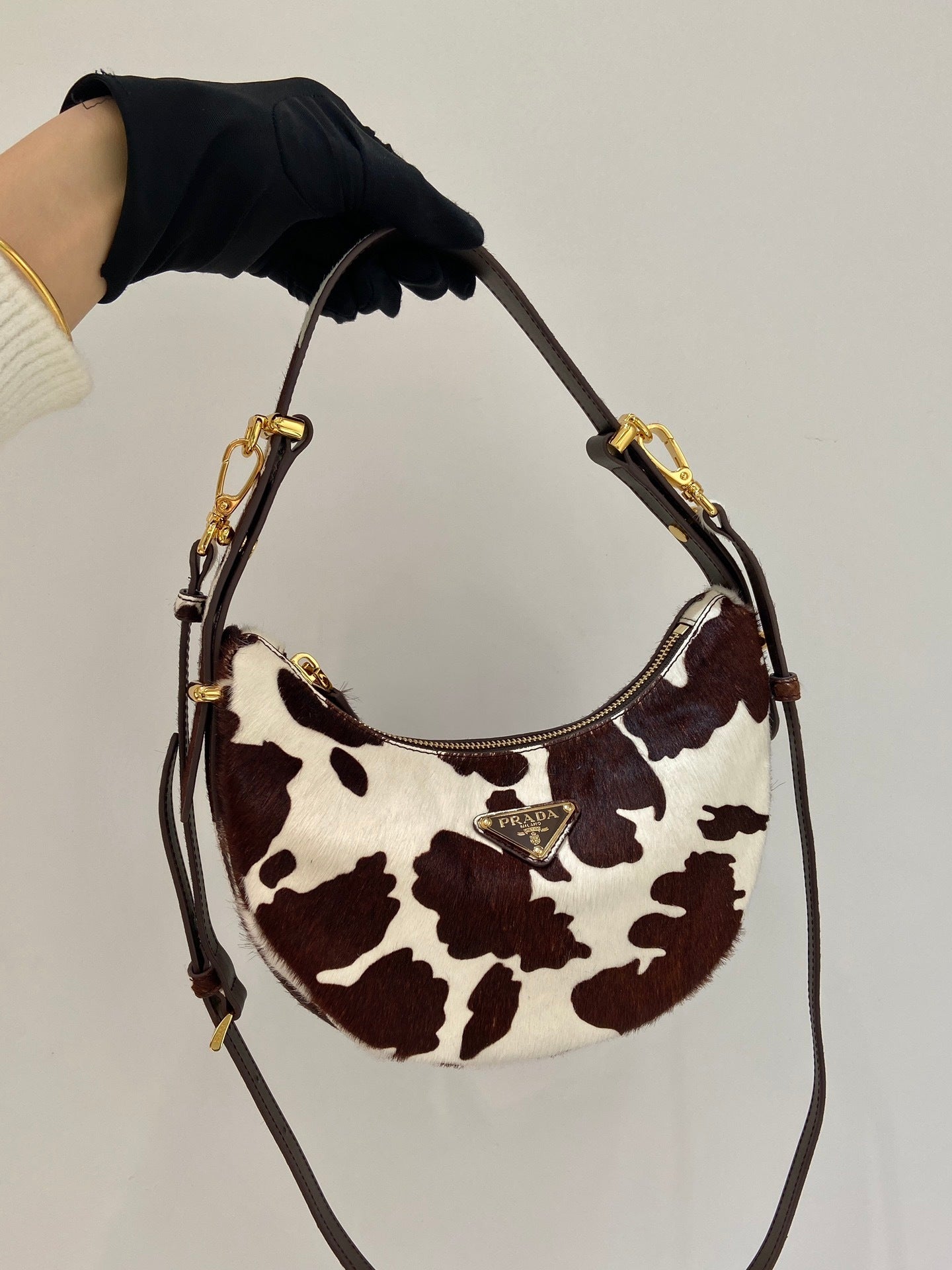 Prada Arqué printed leather mini hobo shoulder bag