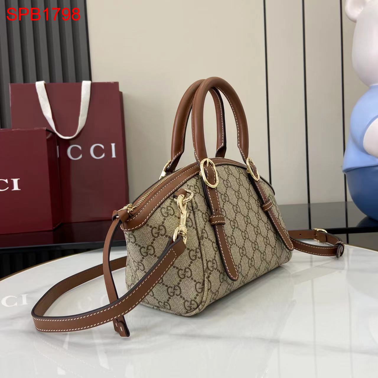 Gucci GG Emblem small top handle bag